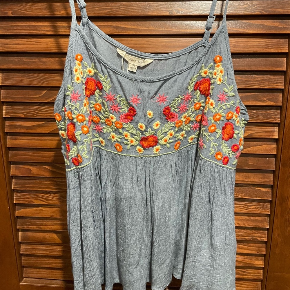 Worn once blue tank top with floral